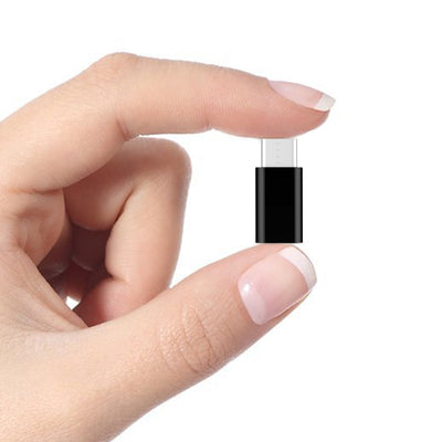 A silver Type-C adapter micro USB female to USB-C male connector.